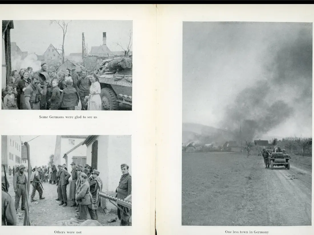 German civilians crowding around an armored car to greet the troops