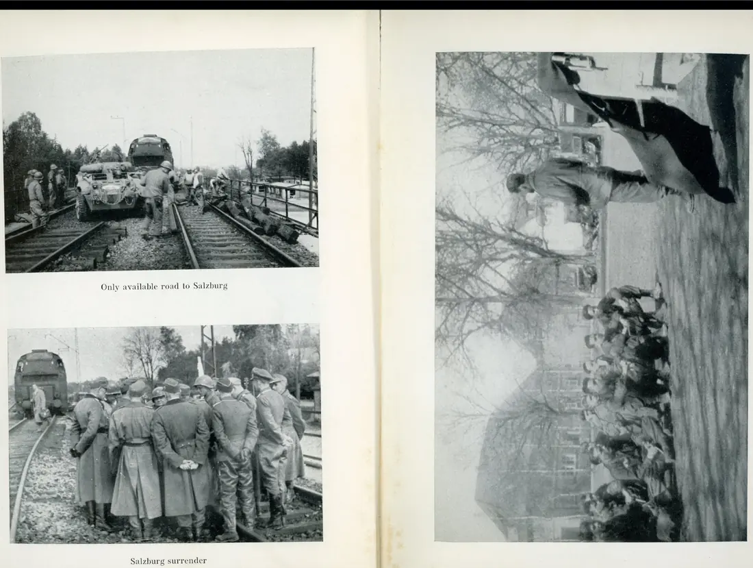 An armored car and men advancing along railroad tracks toward a halted locomotive — the only route open to Salzburg